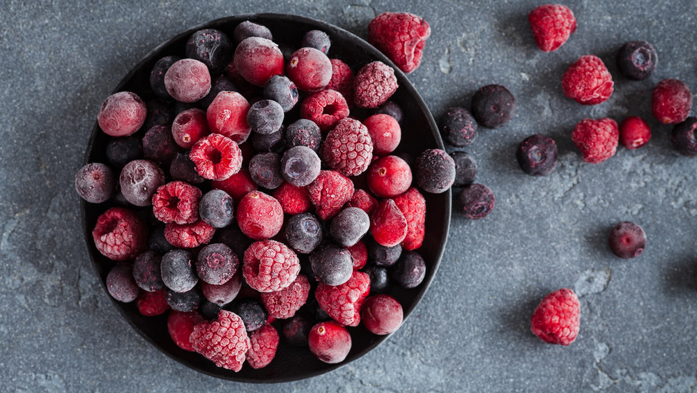 Frozen berries in black bowl