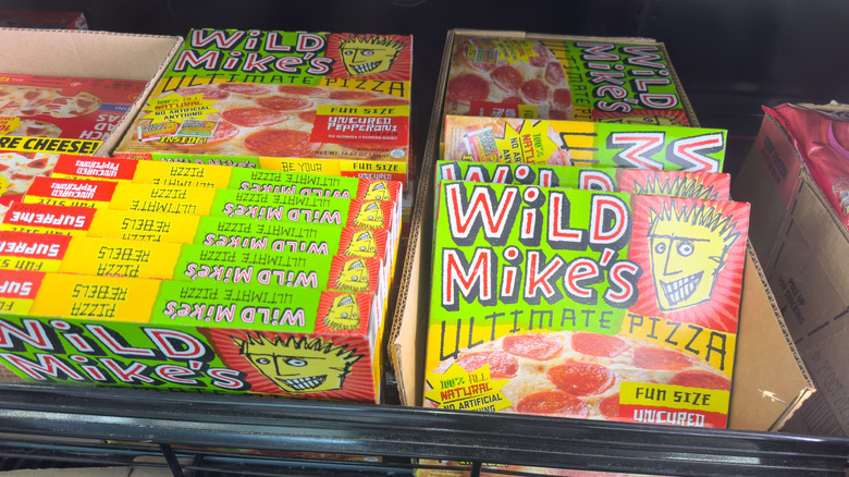 boxes of wild mike's ultimate pepperoni pizza at store in cardboard boxes in freezer section