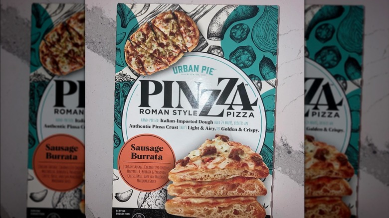 cardboard box of pinzza pizza from urban pie, sausage burrata flavor, on countertop