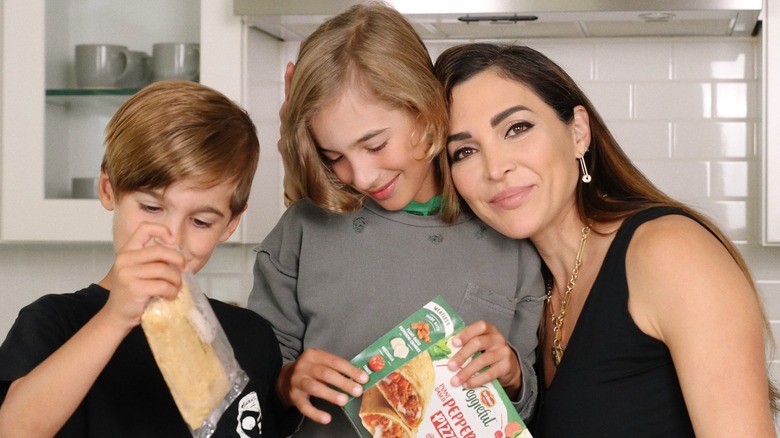Nicole Modic posing with her kids
