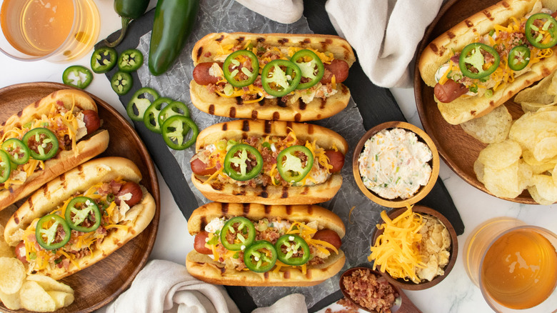 Jalapeño popper hot dogs with various toppings and jalapeño slices