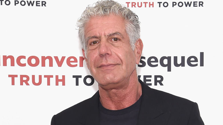 Anthony Bourdain posing at event
