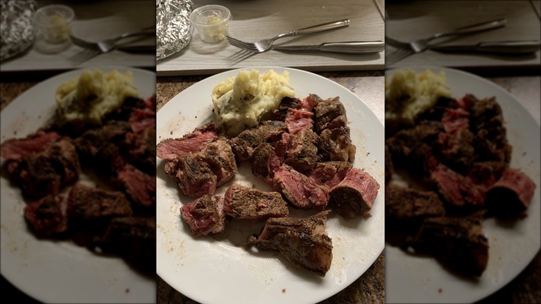 Customer-taken photo of underdone steak at Outback Steakhouse