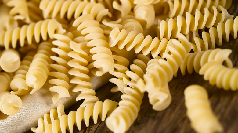 fusilli spilling out of a canvas bag