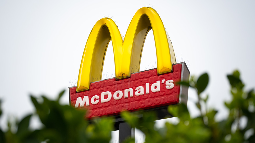 McDonald's sign with green leaves