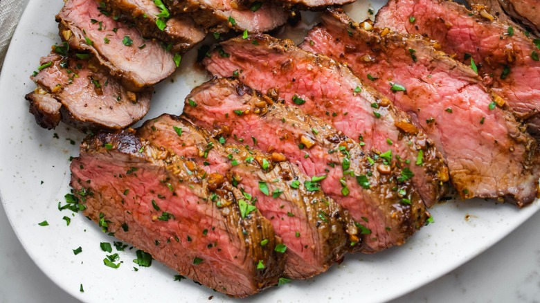 sliced tri-tip roast with parsley