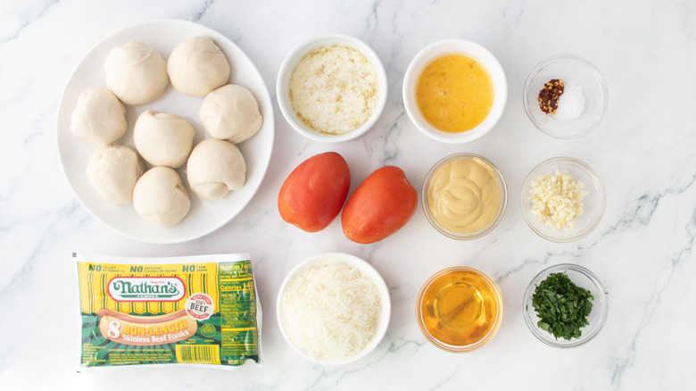 Ingredients for garlic bread wrapped hot dogs with tomato honey mustard