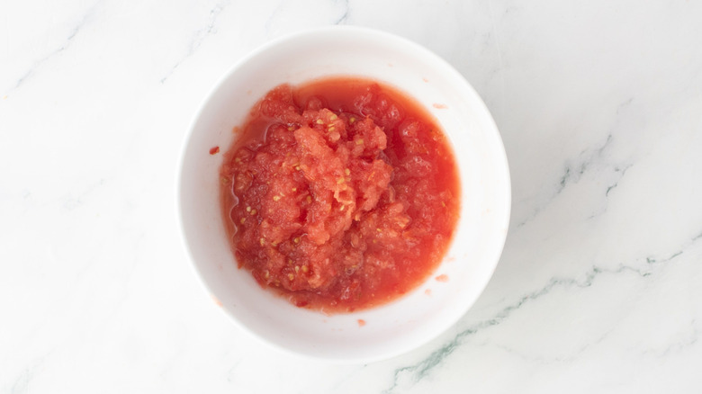 Grated tomato in bowl