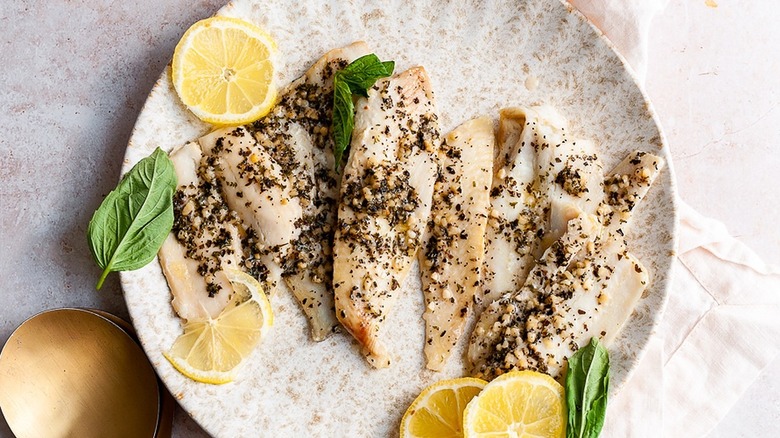 fish on plate with lemons