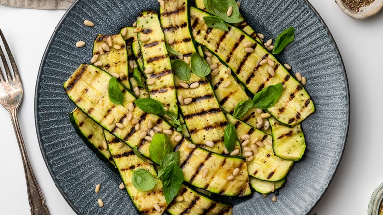 cooked zucchini strips on plate