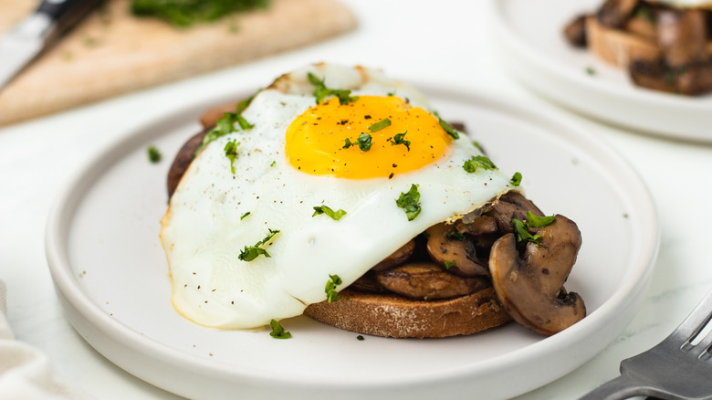 garlicky mushrooms on toast with fried egg