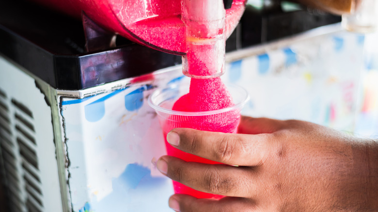 pouring slushie into cup