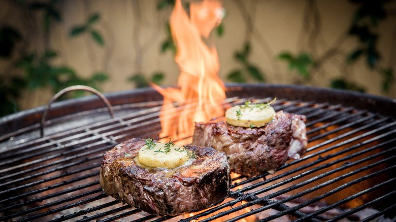 steak on charcoal grill butter