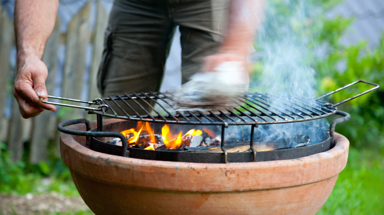charcoal grill man cooking