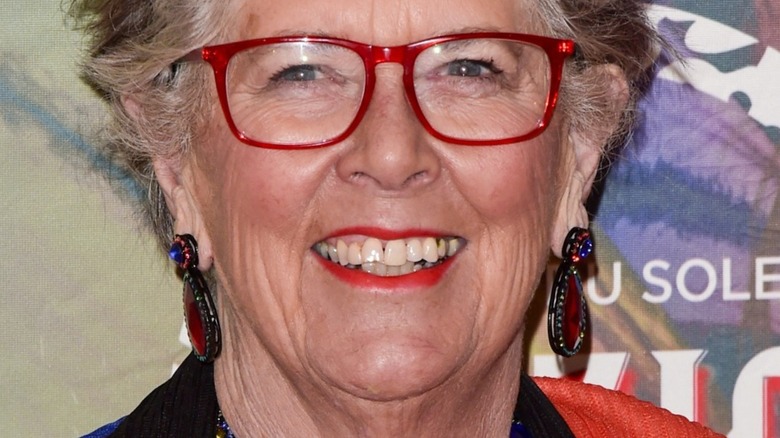 Dame Prue Leith smiling with red glasses on