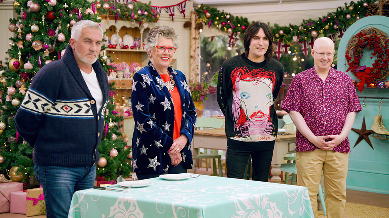 The Great British Baking Show Holiday judges wearing sweaters and smiling