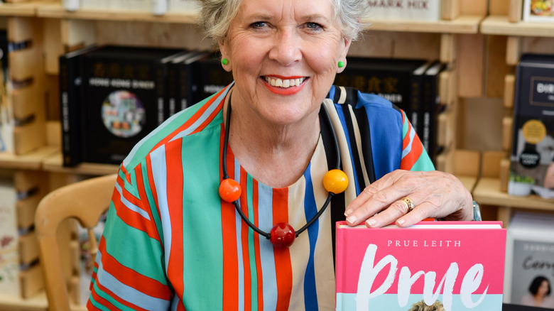 Prue Leith holding book
