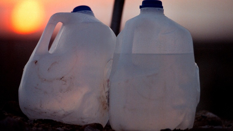 Gallon water bottles on field