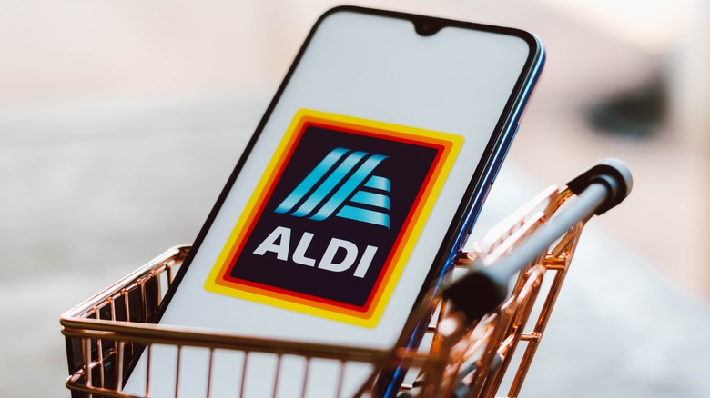 Aldi app on phone in cart