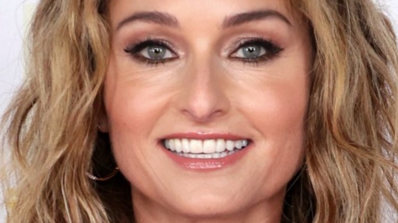 Giada De Laurentiis with hair down and wide smile