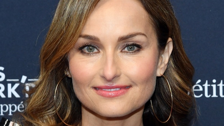 Head shot of Giada De Laurentiis with hoop earrings.