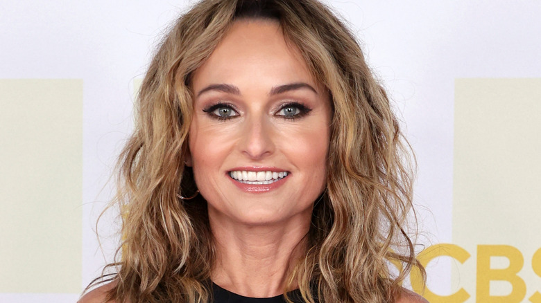 Giada de Laurentiis smiles with curly hair