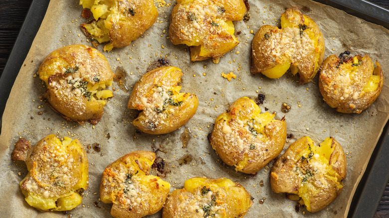 Smashed potatoes topped with Parmesan