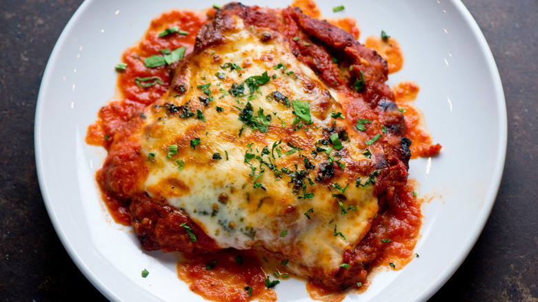 Chicken parmesan on white plate