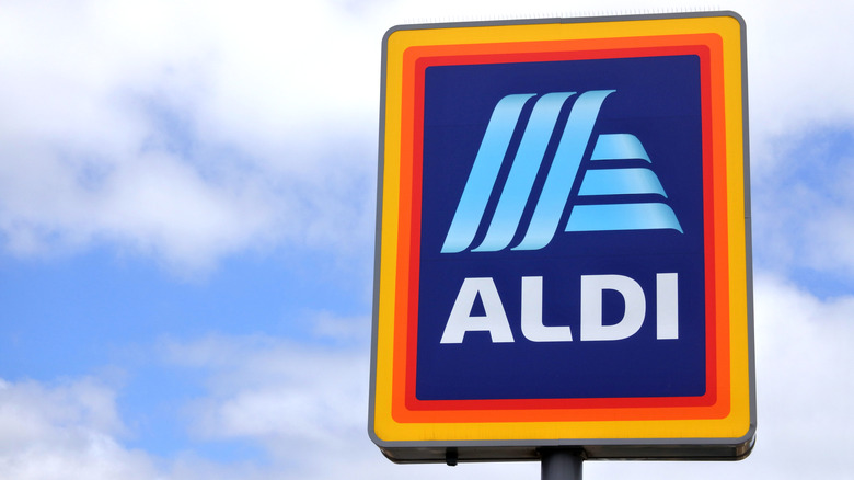 Aldi sign against blue sky