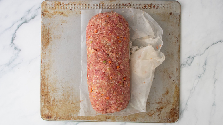 Meatloaf rolled and tucked into log shape