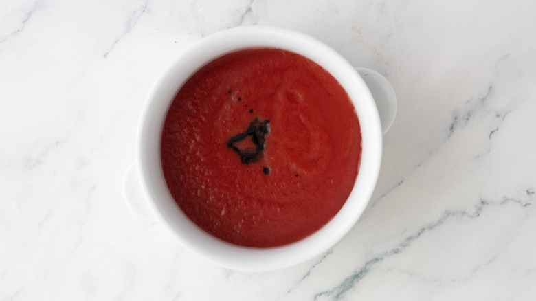 Passata with balsamic vinegar drizzle in bowl