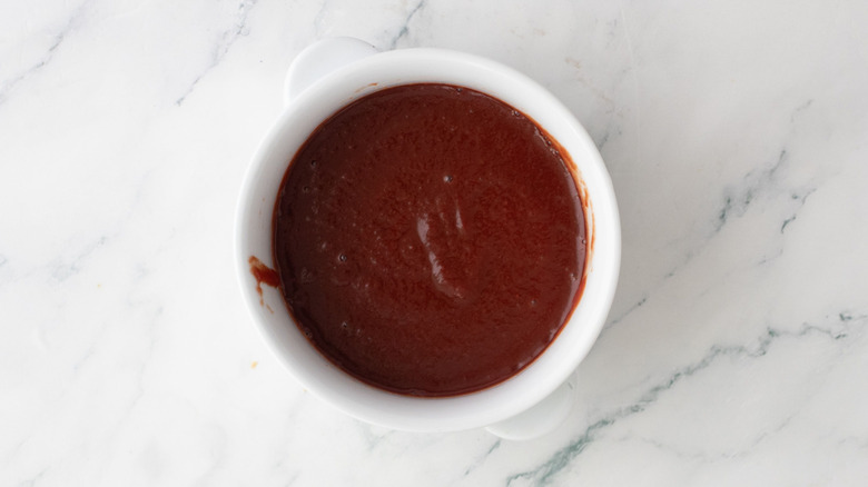 Dark red passata sauce in bowl
