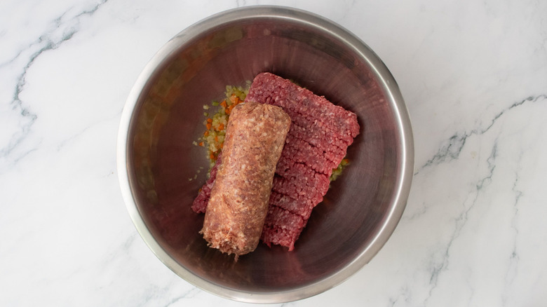 Ground beef and ground sausage in bowl