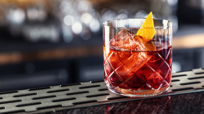 Negroni on a bar with orange peel