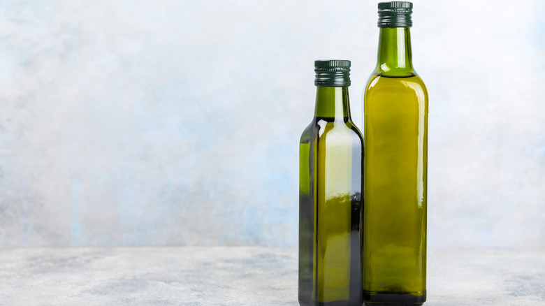 Dark green olive oil bottles without label