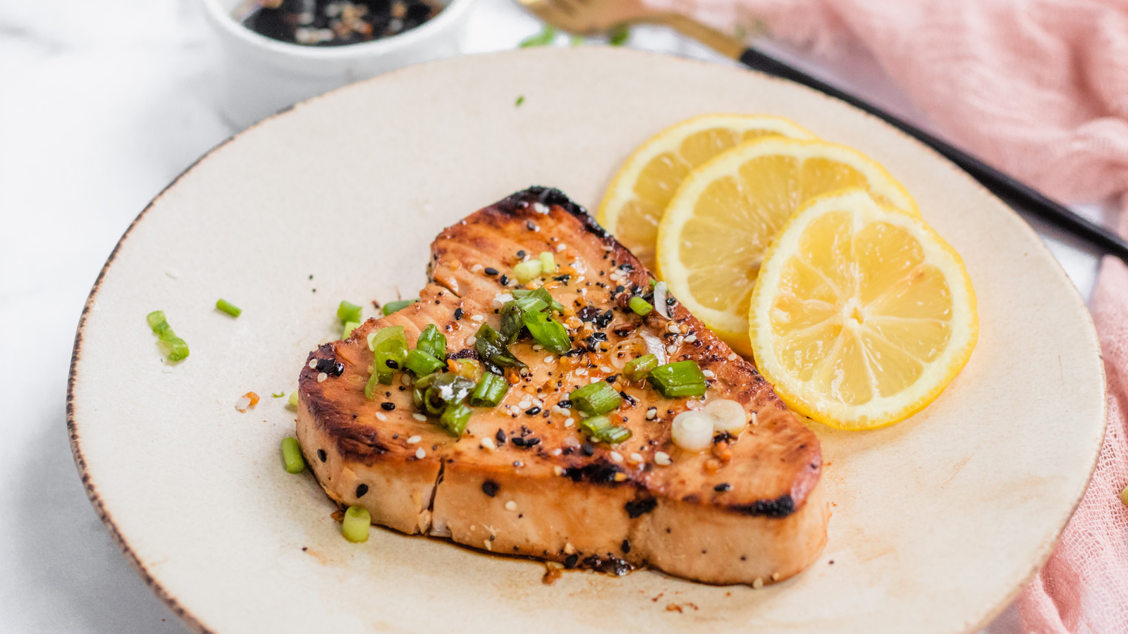 Give Tuna Steak An Easy Flavor Boost With Everything Bagel Seasoning heart-healthy-sesame-tuna-steak-over-greens-recipe