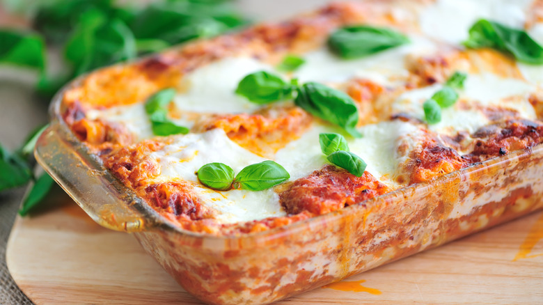 freshly baked lasagna with basil