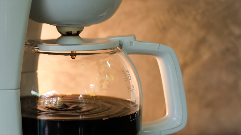 Close-up of a coffee maker with a glass carafe.