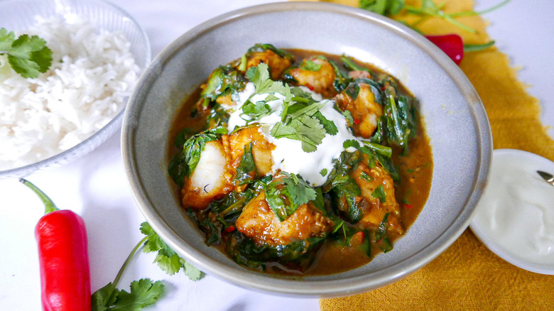 fish curry in bowl with cilantro