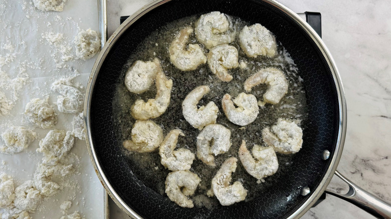 Shrimp frying in pan