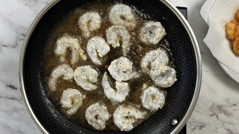 Shrimp frying in pan