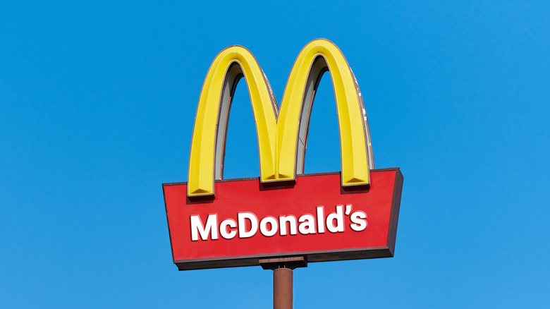McDonald's yellow arches against blue sky background