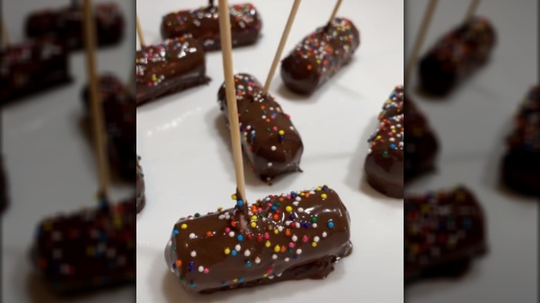 Sausages covered in chocolate and sprinkles