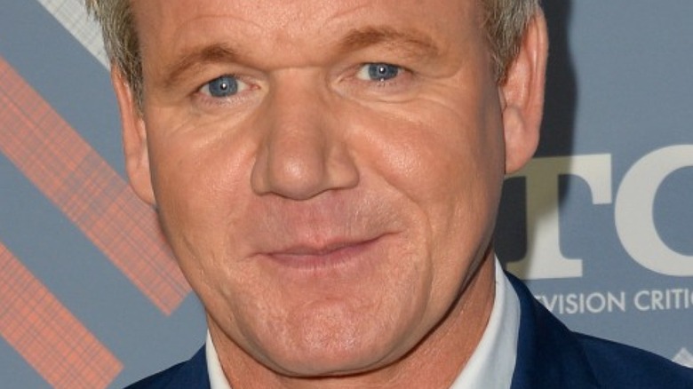 Gordon Ramsay on the red carpet with slight smile