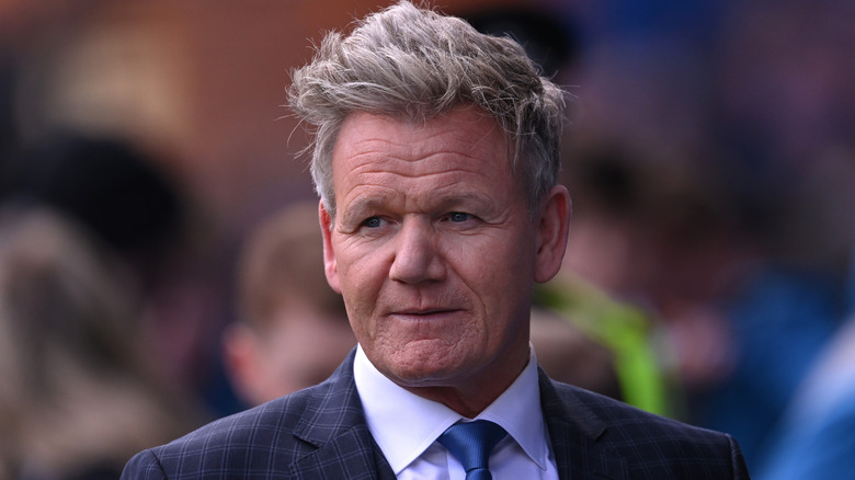 Gordon Ramsay in a suit, looking stern