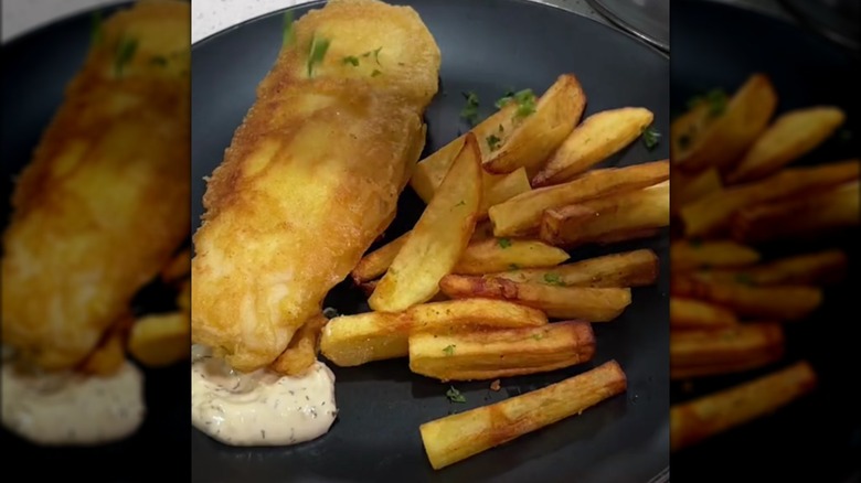 fish and chips on wooden slab
