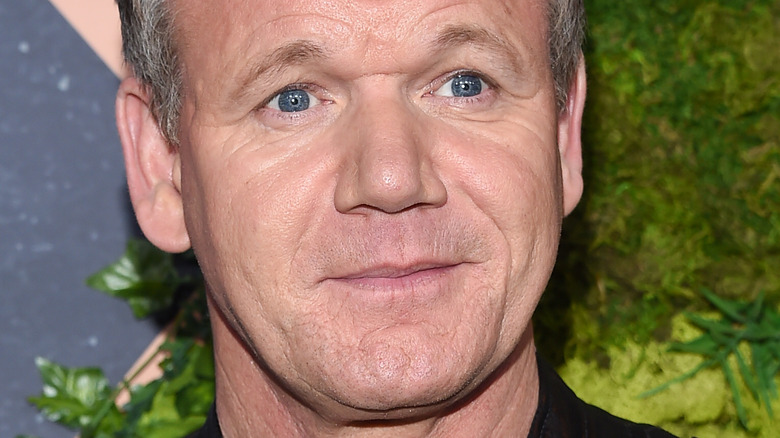 Gordon Ramsay on the red carpet with slight smile