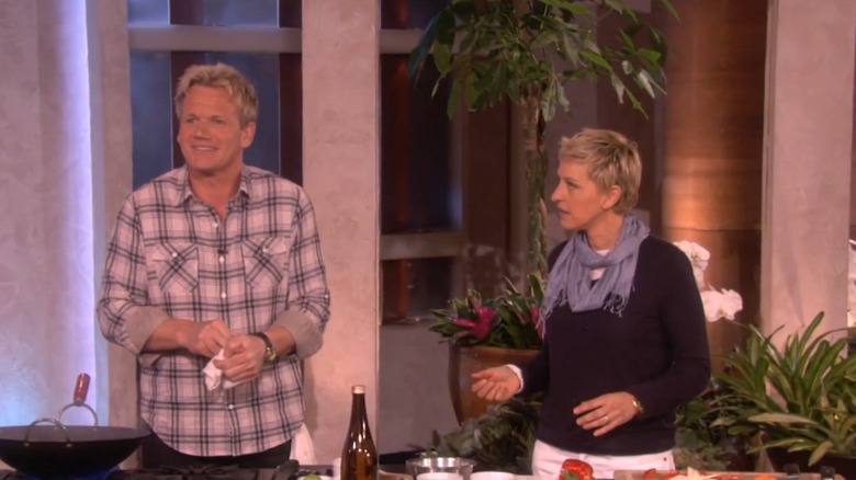 Gordon Ramsay clutches a cut on his finger while Ellen DeGeneres looks on