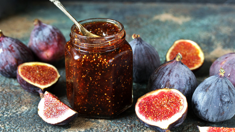 A jar of fig jam with sliced figs