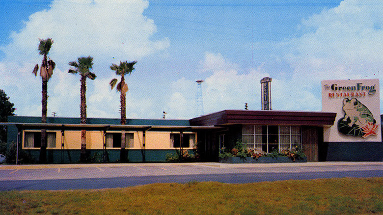 An exterior view of The Green Frog Restaurant with visible signage